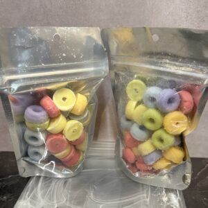 Two bags filled with colorful candy rings.