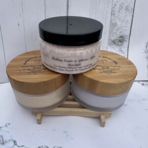 Three wooden jars and one black-lidded jar on a wooden stand.