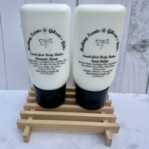 Two white bottles of daily hair care products on a wooden rack.